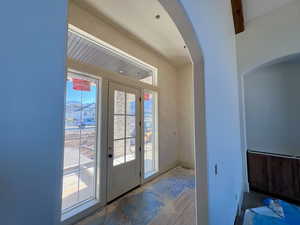 Entryway featuring arched walkways