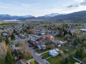 Birds eye view of property featuring a mountain view and a residential view