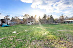 View of yard with an outbuilding
