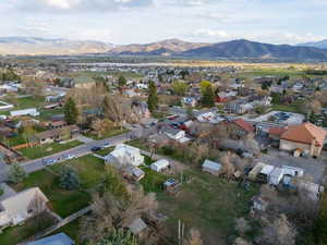Birds eye view of property featuring a mountain view and a residential view