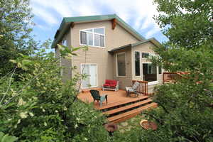 Rear view of house featuring a deck