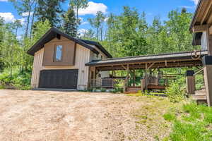 Exterior space with dirt driveway
