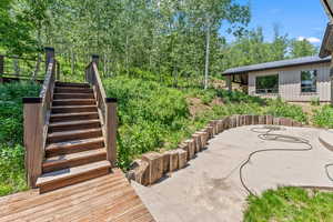 View of patio featuring stairs