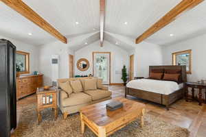 Bedroom with recessed lighting, beam ceiling, baseboards, and multiple windows