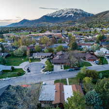 Aerial view at dusk featuring a residential view and a mountain view