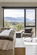 Primary Bedroom featuring wood finished floors and a mountain view