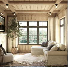 Sunroom featuring beamed ceiling and coffered ceiling