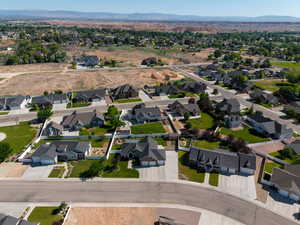Aerial view of property's location featuring mountains and nearby suburban area