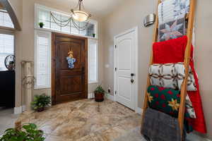 Foyer featuring baseboards