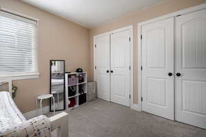 Sitting room with carpet floors and plenty of natural light