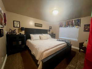 Carpeted bedroom with baseboards