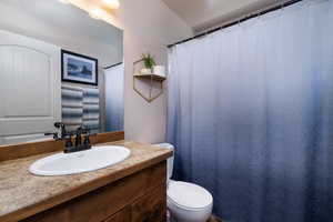 Bathroom featuring vanity and toilet