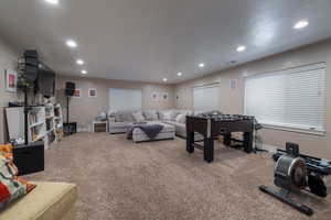 Playroom with recessed lighting and carpet