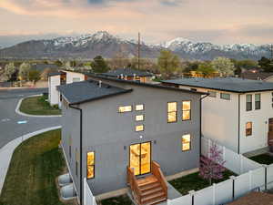 Exterior space featuring fence and a mountain view