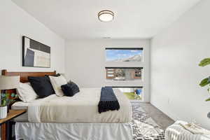 Bedroom featuring visible vents, baseboards, and carpet flooring