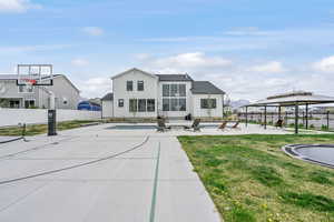 Exterior space with a gazebo, a yard, a patio area, and fence