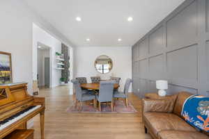 Dining space with light wood-style flooring, baseboards, and recessed lighting