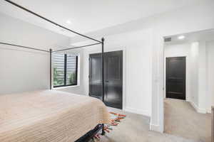 Carpeted bedroom with visible vents, baseboards, and recessed lighting