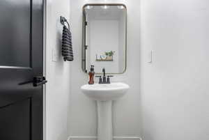 Bathroom featuring baseboards