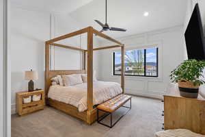 Bedroom featuring a decorative wall, vaulted ceiling, ceiling fan, light colored carpet, and recessed lighting