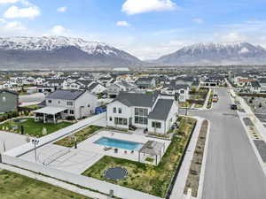 Birds eye view of property featuring a mountain view and a residential view