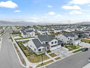 Birds eye view of property with a mountain view and a residential view