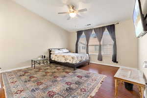 Spacious primary bedroom with vaulted ceilings, located upstairs
