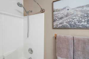 Bathroom with shower / washtub combination