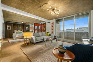 Floor color is changed. Common area with floor to ceiling windows and a view of city