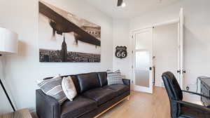 Office space with light wood-style flooring