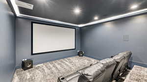 Home theater with visible vents, baseboards, dark carpet, and recessed lighting