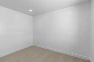 Unfurnished room featuring recessed lighting, baseboards, and light colored carpet
