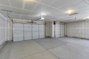Garage featuring a garage door opener