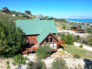 Exterior space with a deck with water view