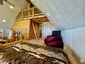 Bedroom featuring vaulted ceiling