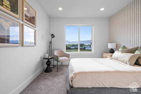 Carpeted bedroom with baseboards and recessed lighting