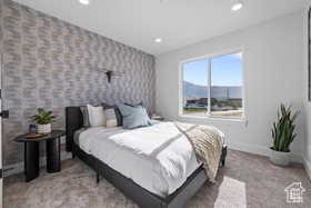 Carpeted bedroom with baseboards and recessed lighting
