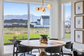 Dining space with a mountain view and a healthy amount of sunlight