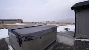 Exterior space with a hot tub