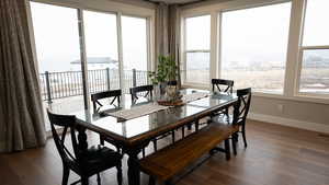 Dining area featuring baseboards and wood finished floors