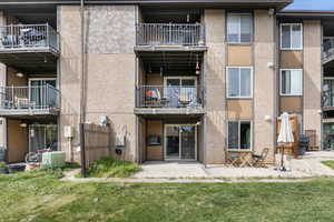 Private cement patio provides plenty of room for an outdoor table and chairs.