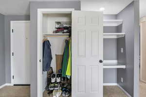 View of coat closet. This condo features lots of extra storage space, including hallway closet and large walk-in closet in master bedroom. Outside storage off patio also available.