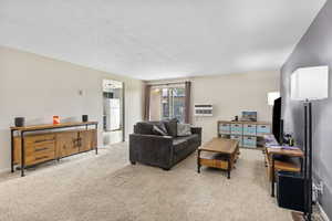 Spacious living area near kitchen with walkout patio.