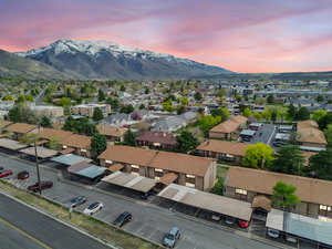 Birds eye view of property with a mountain view and a residential view