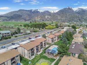 Birds eye view of property with a residential view and a mountain view