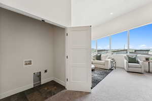 Laundry room with hookup for an electric dryer, washer hookup, and carpet floors