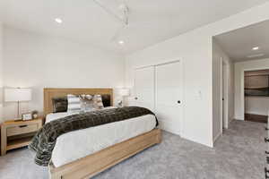 Carpeted bedroom featuring recessed lighting, a closet, and ceiling fan