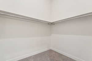 Spacious closet with carpet floors