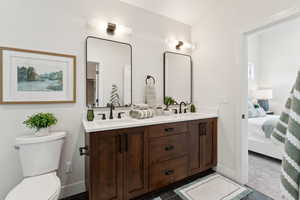Ensuite bathroom with double vanity and toilet