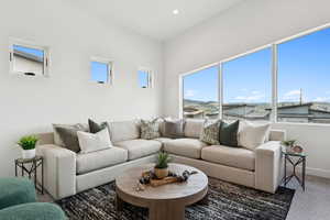 Living room featuring carpet and a mountain view